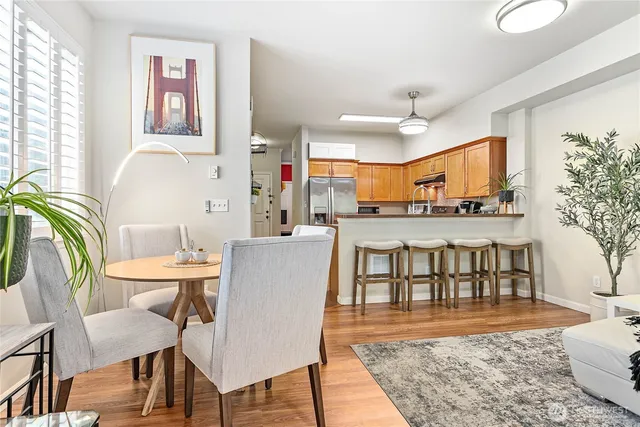 a view of a dining room with furniture and wooden floor