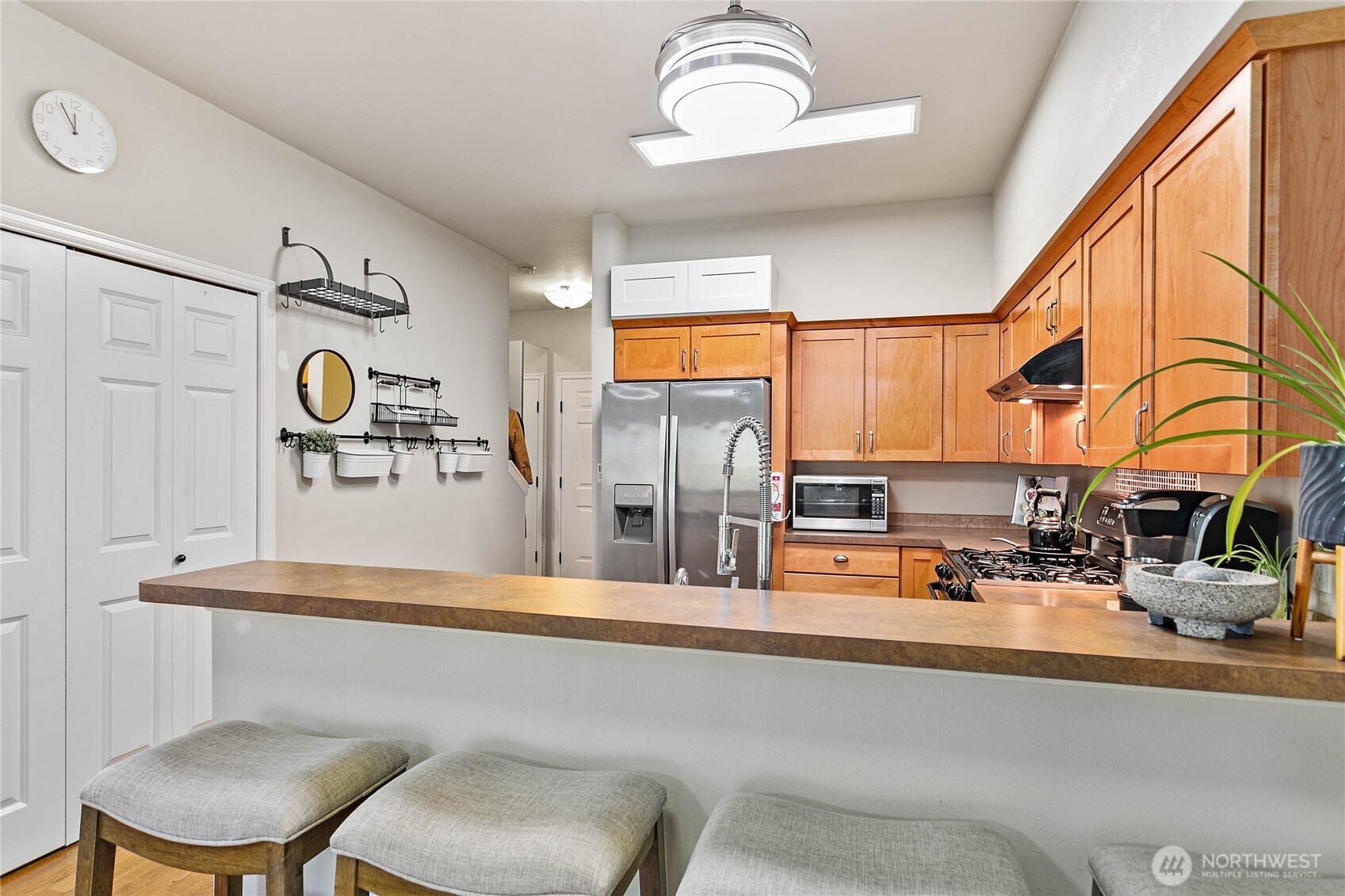 1384 Bayview Court, Unit E1 Blaine, WA 98230 - Photo 15 of 33 a kitchen with a refrigerator and a sink