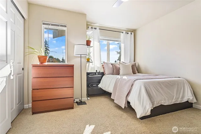 a bedroom with a bed and a dresser