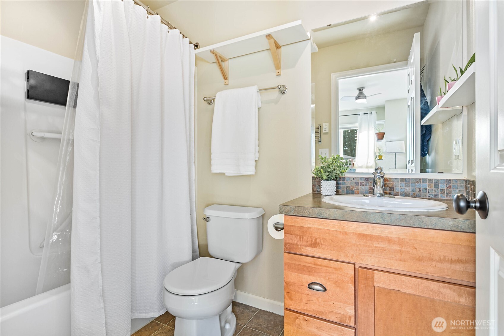 1384 Bayview Court, Unit E1 Blaine, WA 98230 - Photo 27 of 33 a bathroom with a sink toilet and shower