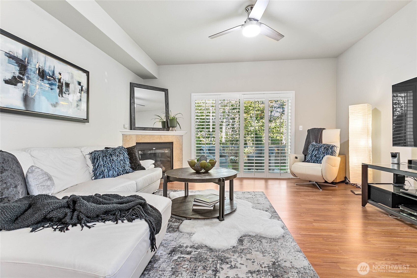 1384 Bayview Court, Unit E1 Blaine, WA 98230 - Photo 5 of 33 a living room with furniture large window and a table