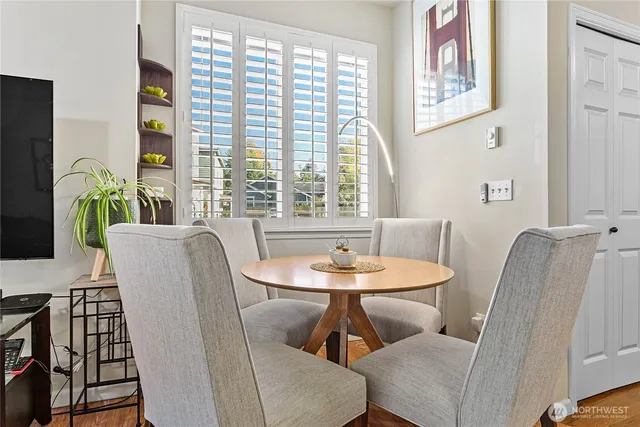 a dining room with furniture and window
