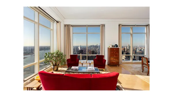 a dining room with furniture and a floor to ceiling window