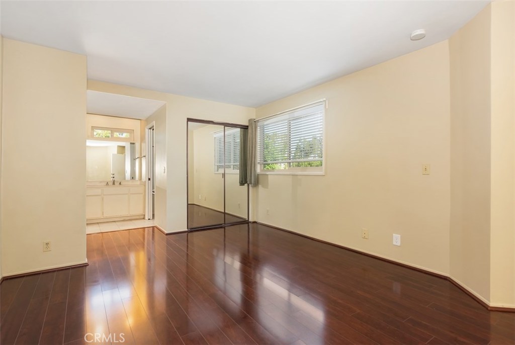 43 Morena Irvine, CA 92612 - Photo 25 of 42 a view of an empty room with wooden floor and a window
