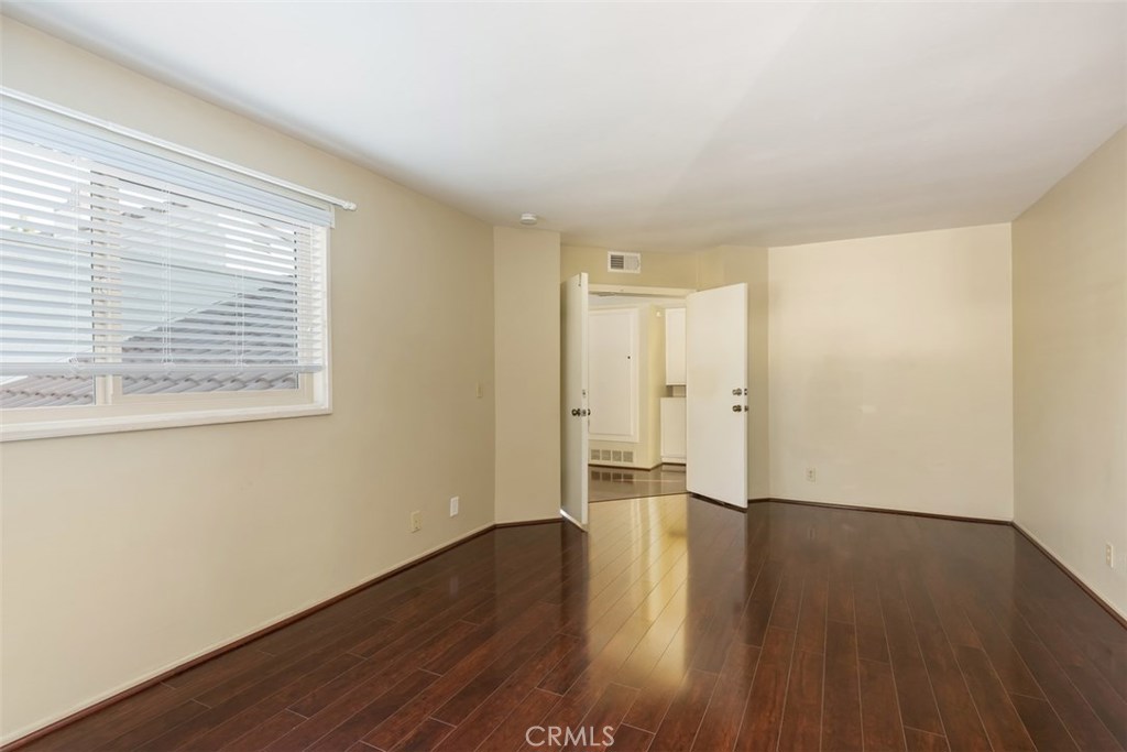 43 Morena Irvine, CA 92612 - Photo 26 of 42 a view of an empty room with wooden floor and a window