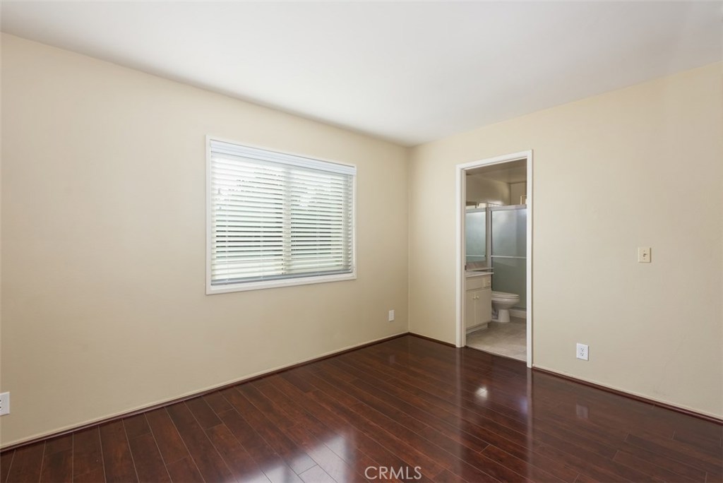 43 Morena Irvine, CA 92612 - Photo 31 of 42 an empty room with wooden floor and windows