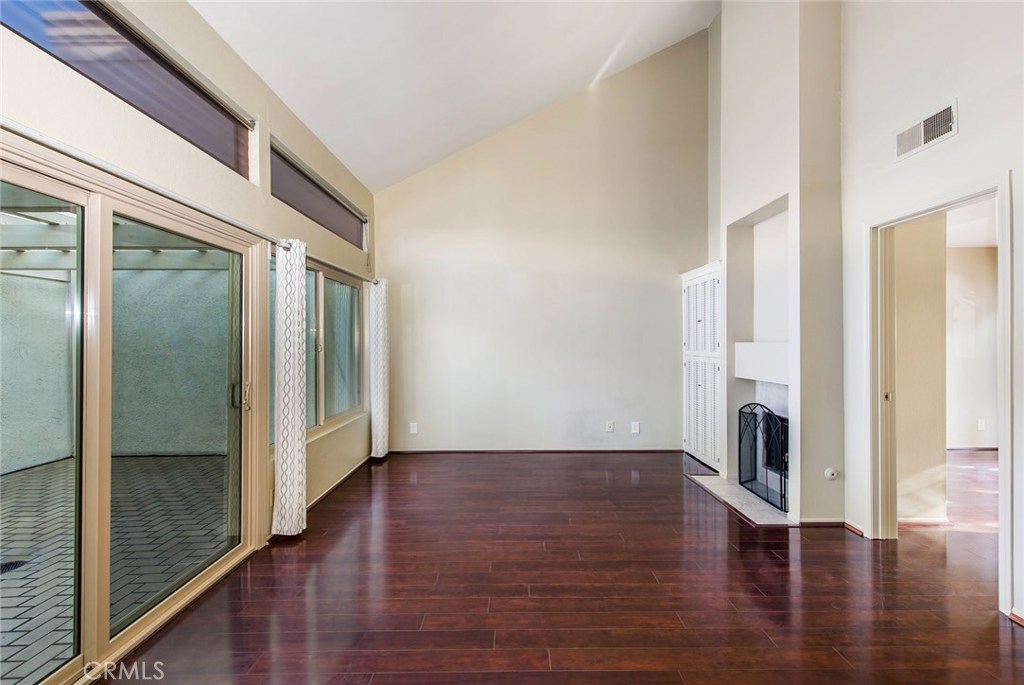 43 Morena Irvine, CA 92612 - Photo 10 of 42 a view of an empty room with wooden floor and a window