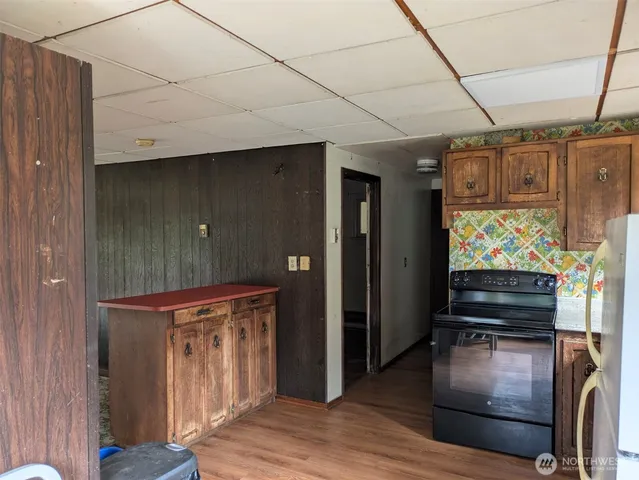 a area with wooden floor and furniture