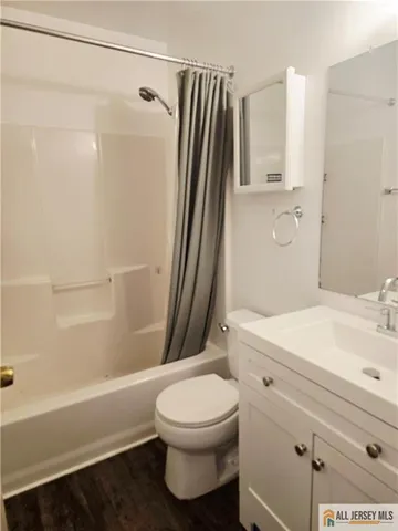 a bathroom with a sink a toilet and a bathtub