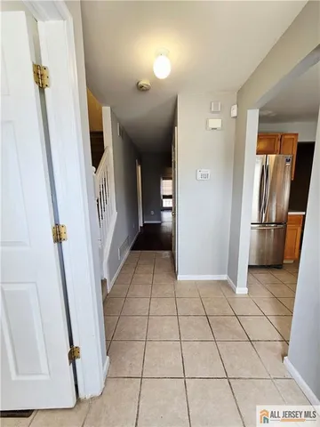 a view of an entryway with a door