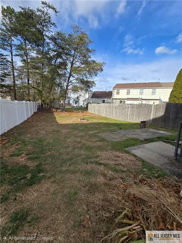 a view of a big yard with large trees