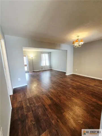 a view of livingroom and hardwood floor