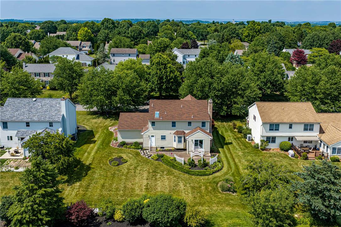 4568 Greenfield Road Bethlehem, PA 18017 - Photo 54 of 59 An aerial perspective reveals a charming residence nestled amidst a verdant neighborhood with ample yard space.