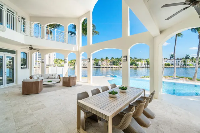 a spacious bedroom with a bed and glass wall