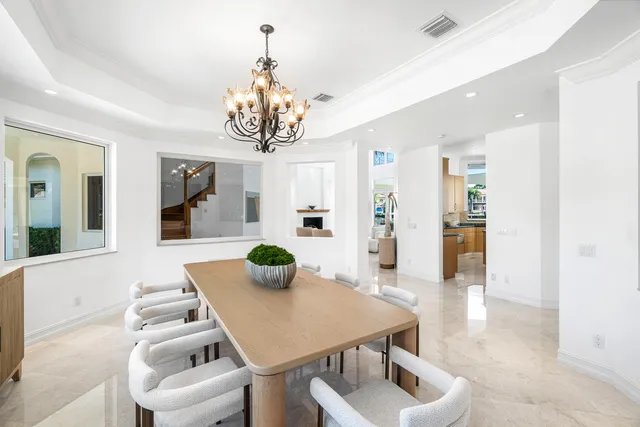 a large bathroom with a granite countertop tub a sink and a large window