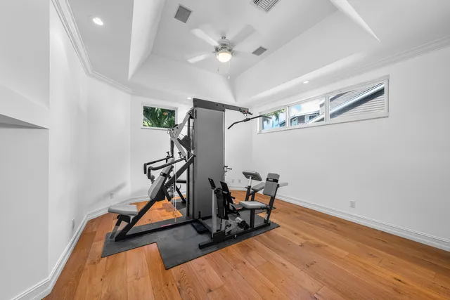 a living room with furniture and a large window with garden view