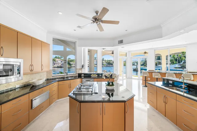 a living room with furniture a flat screen tv and a large window