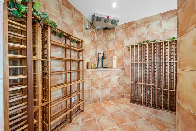 a large bathroom with a granite countertop tub a double vanity sink and a large mirror