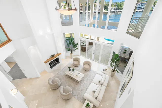 an empty room with fan and windows