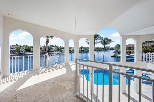 a bathroom with a granite countertop sink a toilet a mirror and shower