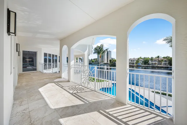 a view of a house with swimming pool and sitting area