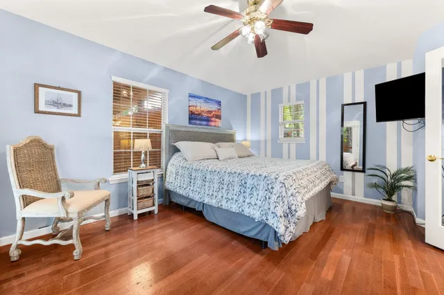 a living room with furniture and a kitchen view
