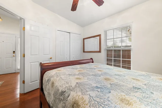 a bedroom with a bed and cabinet