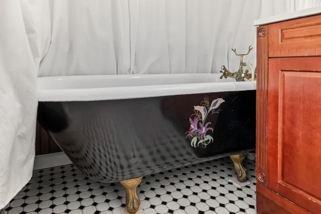 a bathroom with a sink vanity and a mirror