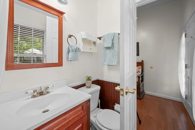 a white bath tub sitting next to a white wall