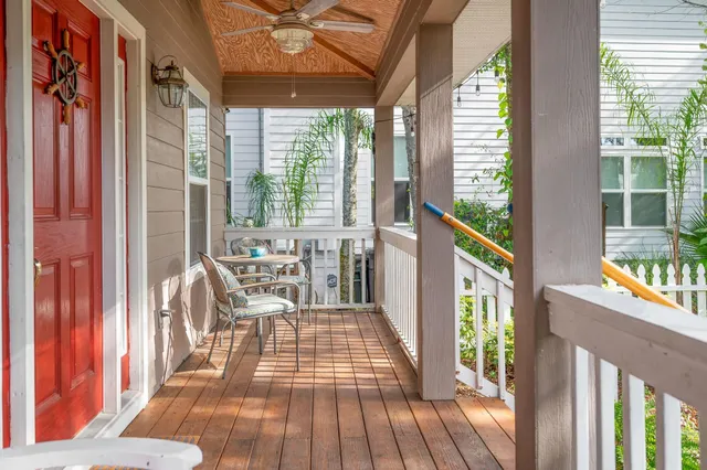 a view of a balcony with wooden floor
