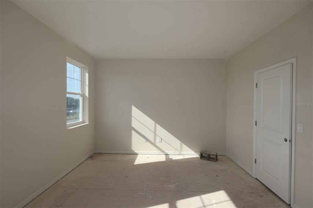 5204 Ctr Lk Rnch Boulevard St. Cloud, FL 34771 - Photo 11 of 24 a view of an empty room and window