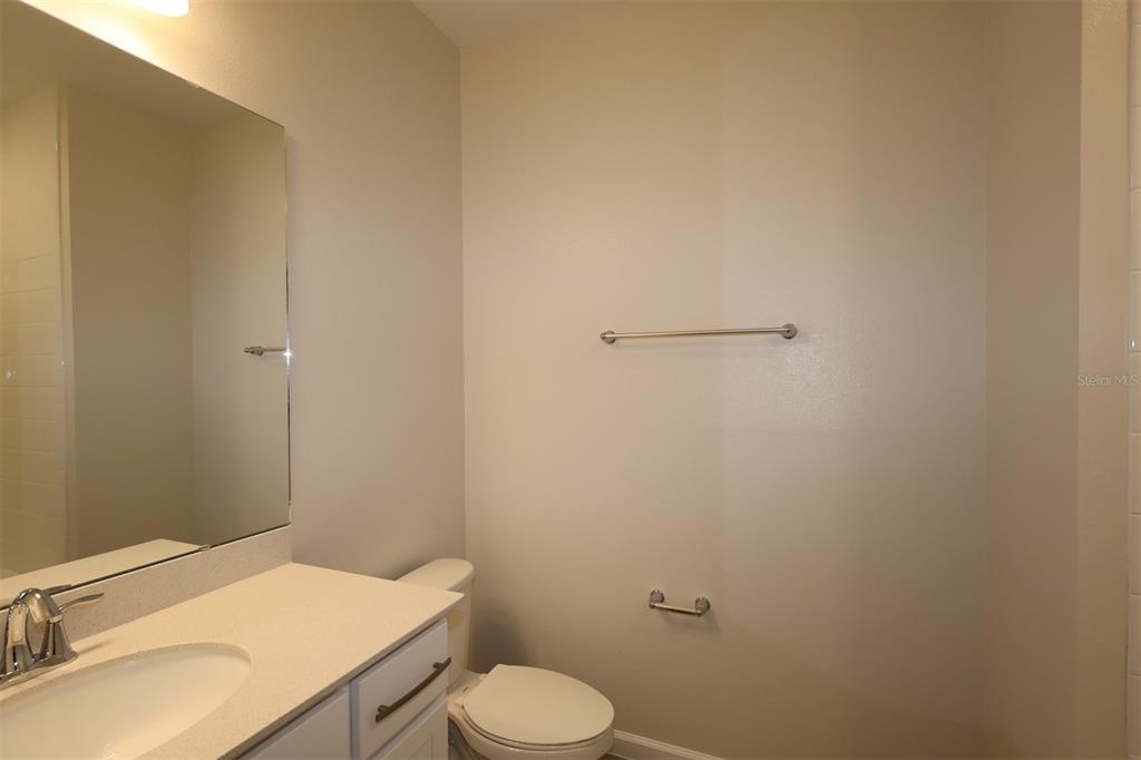 5204 Ctr Lk Rnch Boulevard St. Cloud, FL 34771 - Photo 13 of 24 a bathroom with a sink toilet and vanity
