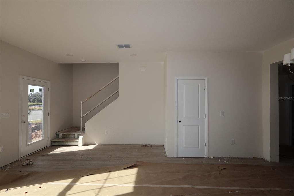 5204 Ctr Lk Rnch Boulevard St. Cloud, FL 34771 - Photo 17 of 24 a view of empty room with wooden floor and fan