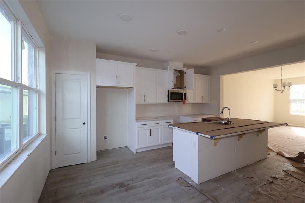 5204 Ctr Lk Rnch Boulevard St. Cloud, FL 34771 - Photo 5 of 24 a kitchen with a sink stove and refrigerator