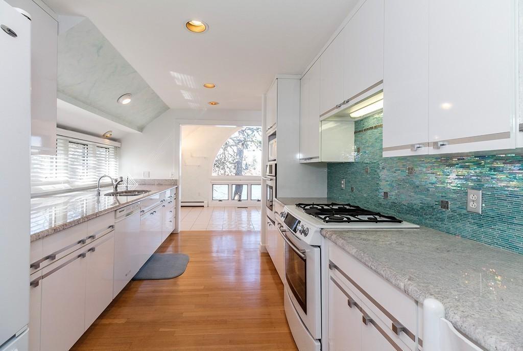 94 Summersea Road Mashpee, MA 02649 - Photo 4 of 25 a large kitchen with stainless steel appliances granite countertop a stove and a sink