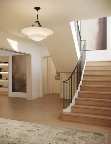 a view of staircase with white walls and windows
