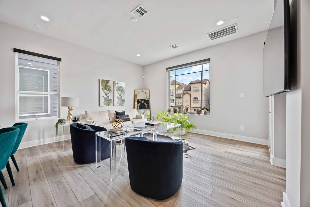 705 Gregg Street Houston, TX 77020 - Photo 10 of 27 a view of a dining room with furniture window and wooden floor
