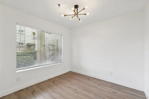a kitchen with stainless steel appliances granite countertop a refrigerator a sink a stove a microwave and wooden cabinets