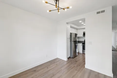 a kitchen with stainless steel appliances granite countertop a refrigerator stove and sink