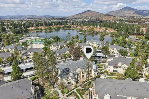 an aerial view of a house with a lake view