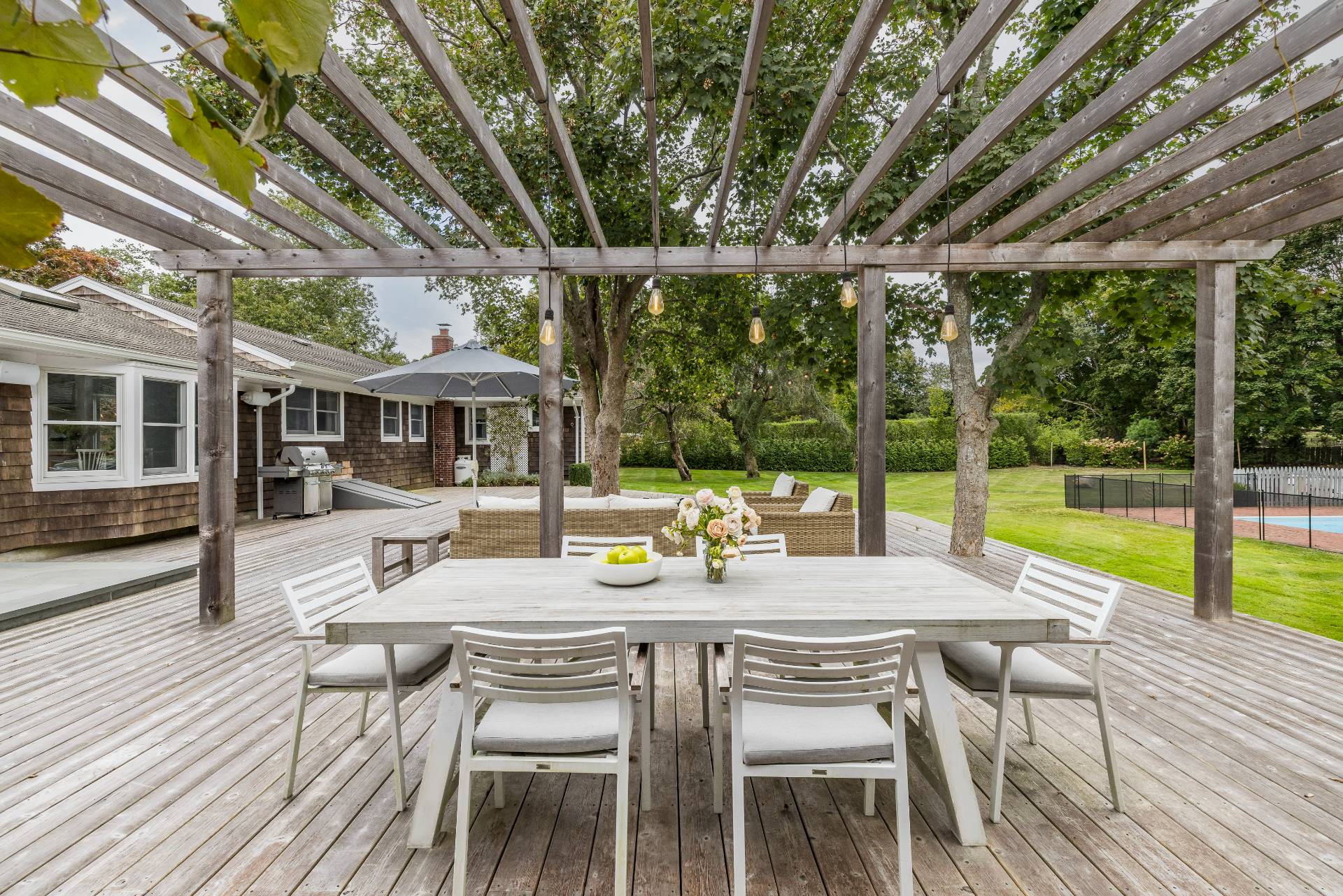 14 Sunset Road Sag Harbor, NY 11963 - Photo 16 of 19 a view of a patio with a table chairs and a table