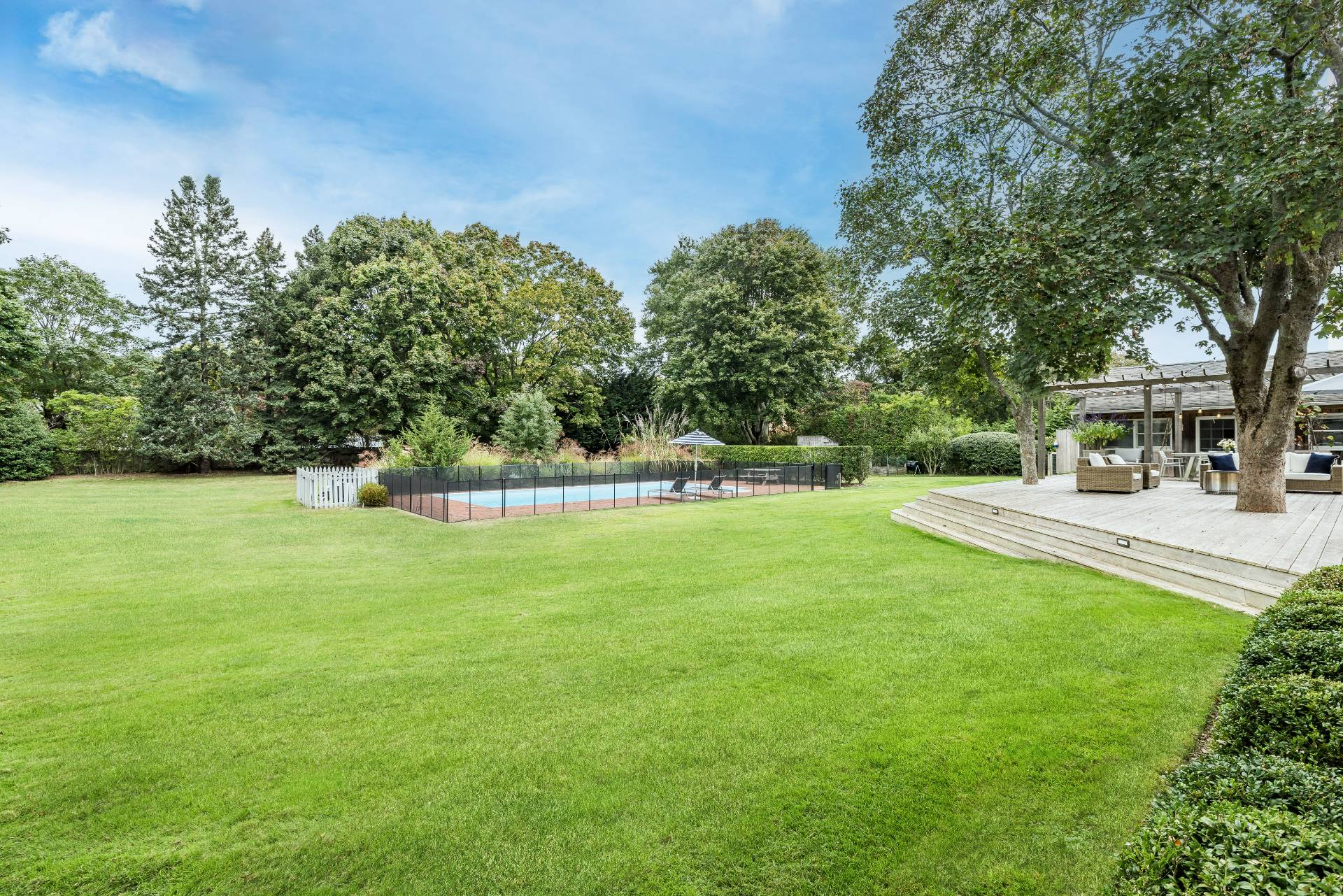 14 Sunset Road Sag Harbor, NY 11963 - Photo 18 of 19 a view of a house with a yard