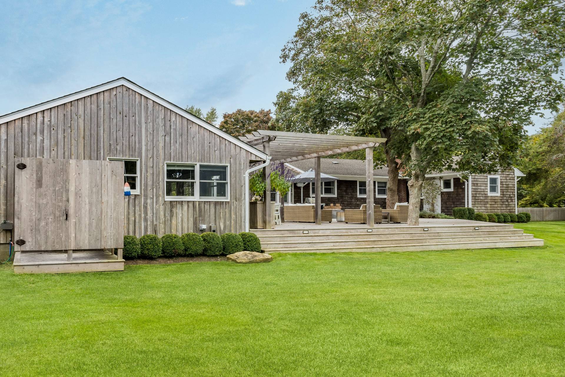 14 Sunset Road Sag Harbor, NY 11963 - Photo 19 of 19 a view of a house with a yard and sitting area