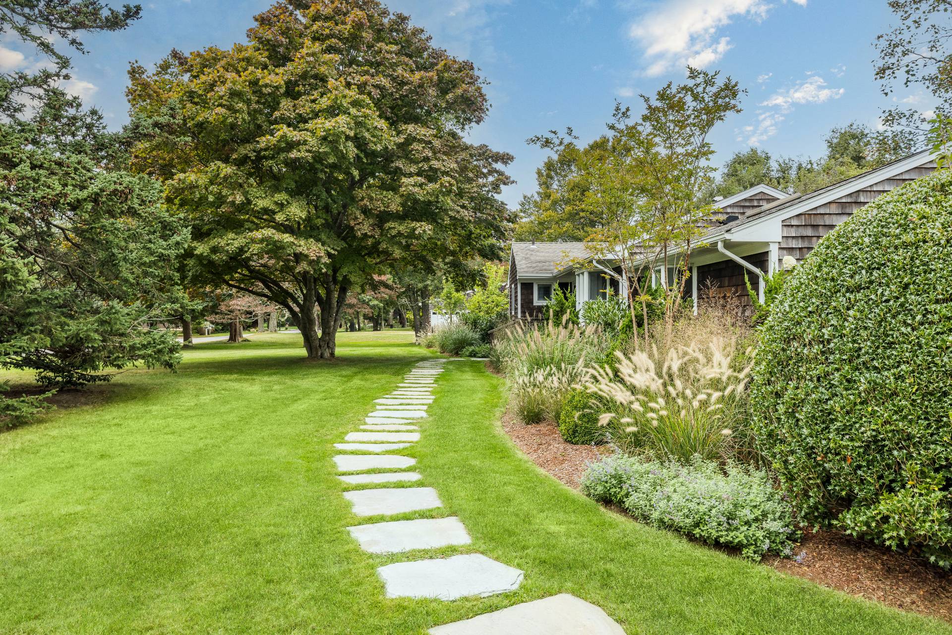 14 Sunset Road Sag Harbor, NY 11963 - Photo 2 of 19 a view of yard with swimming pool and green space