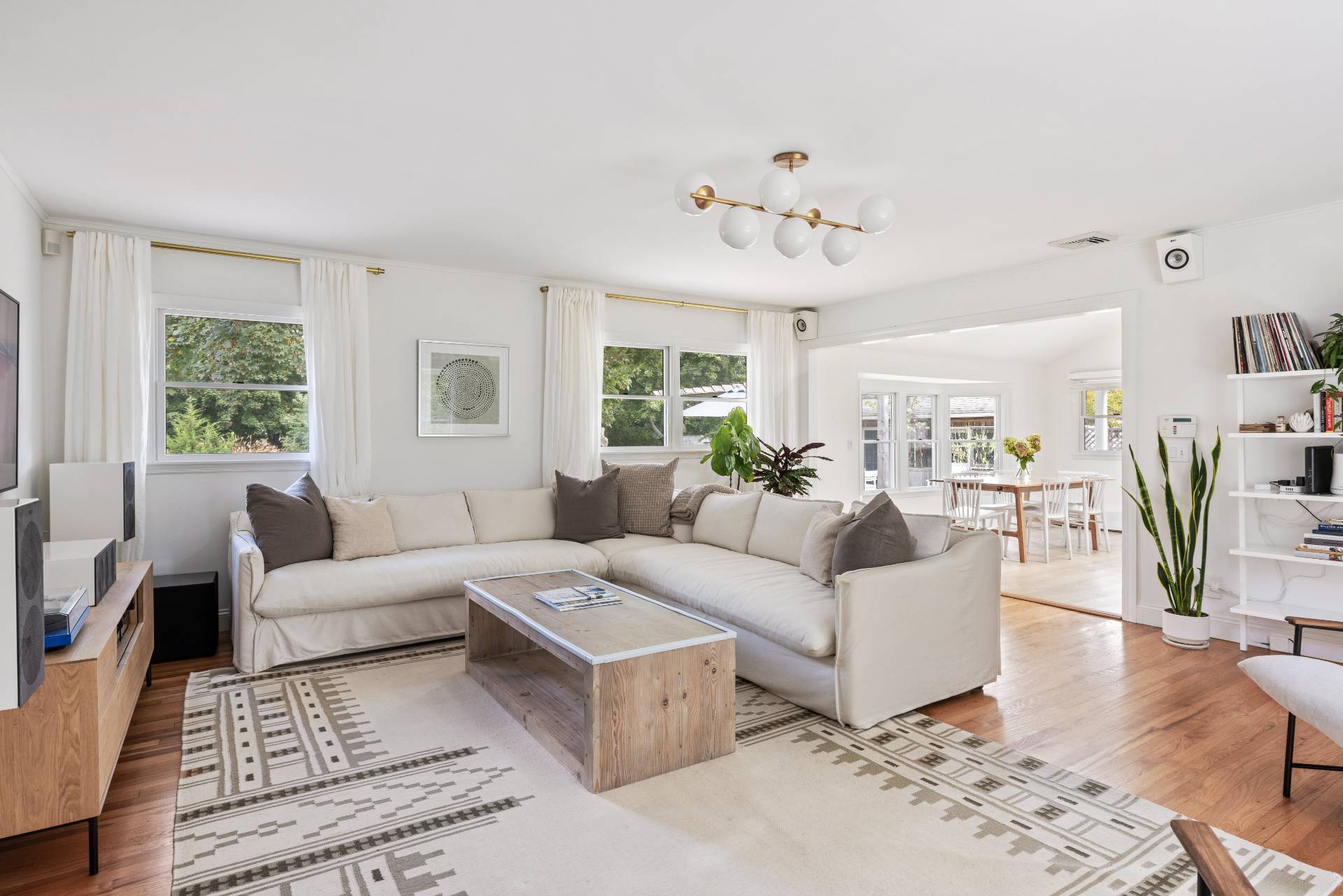 14 Sunset Road Sag Harbor, NY 11963 - Photo 3 of 19 a living room with furniture a large window and a table