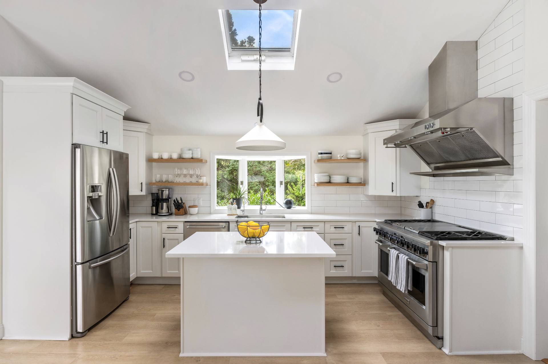 14 Sunset Road Sag Harbor, NY 11963 - Photo 5 of 19 a kitchen with a sink stainless steel appliances a window and a counter top space