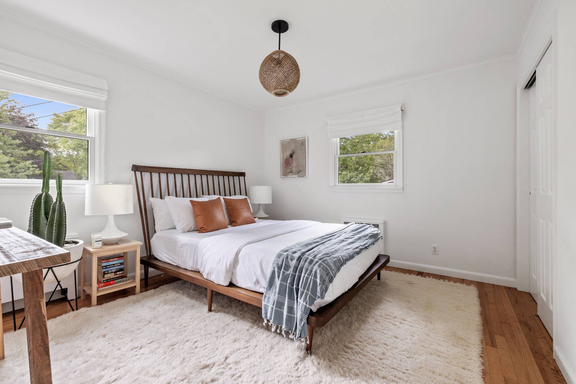 14 Sunset Road Sag Harbor, NY 11963 - Photo 10 of 19 a bedroom with a bed and window