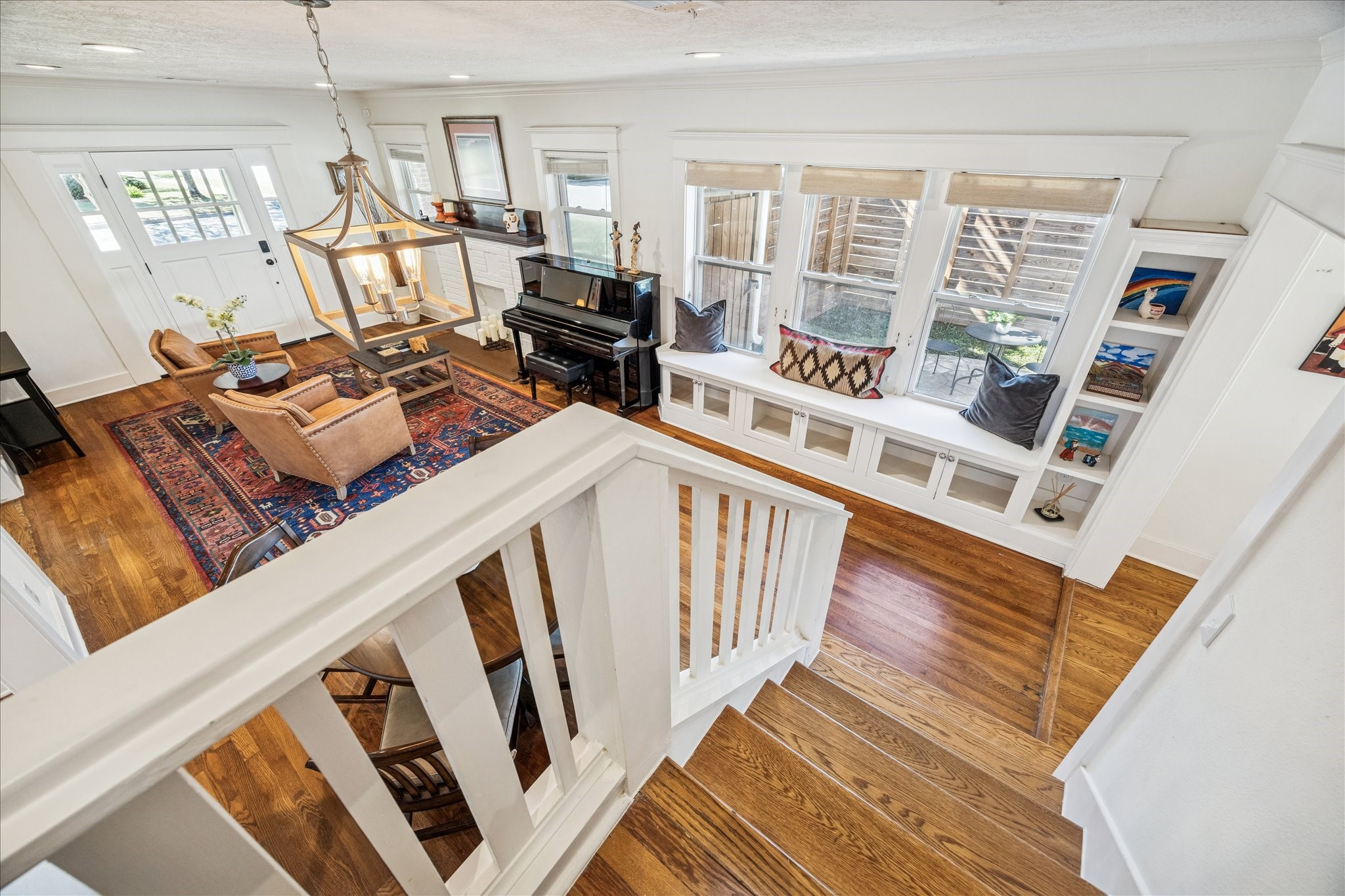 825 Merrill Street Houston, TX 77009 - Photo 15 of 37 Bright and inviting living room with windows lining the wall, flooding the space with natural light.