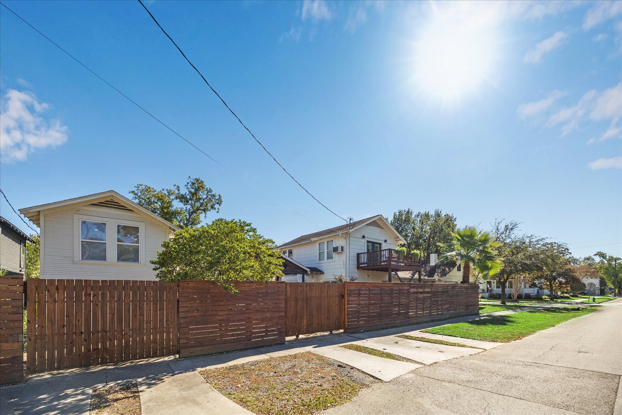 825 Merrill Street Houston, TX 77009 - Photo 34 of 37 This oversized corner lot in Woodland Heights features an automatic gate leading to the carport and a manual gate providing access to a one-car garage.