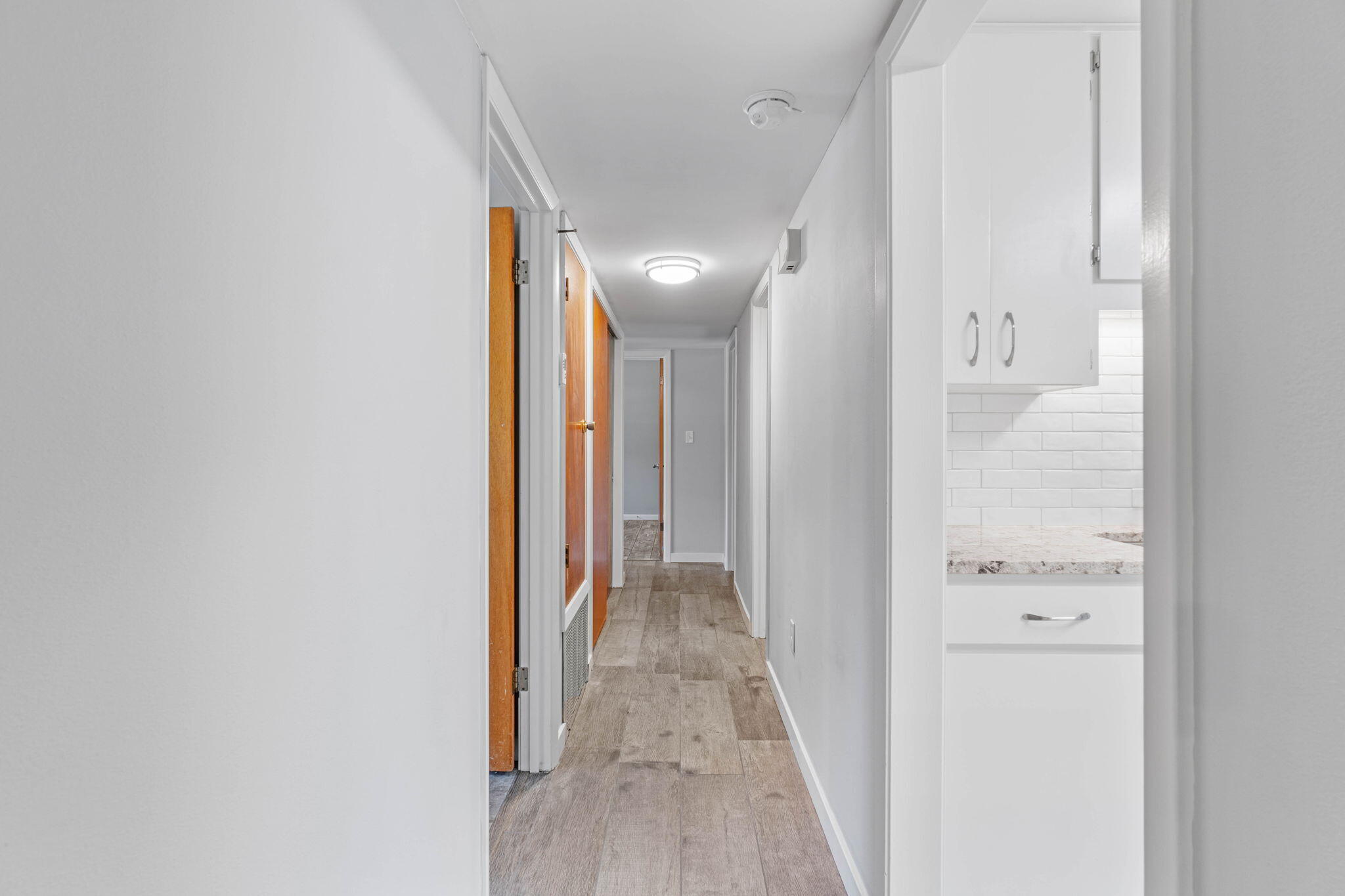 14 9th Street Shalimar, FL 32579 - Photo 14 of 29 a view of a hallway with wooden floor